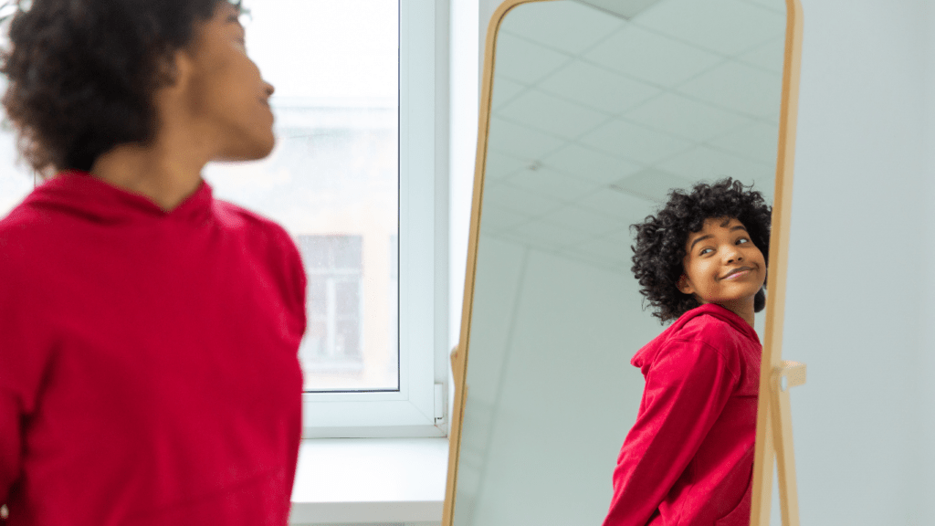 A person is looking at themselves in the mirror