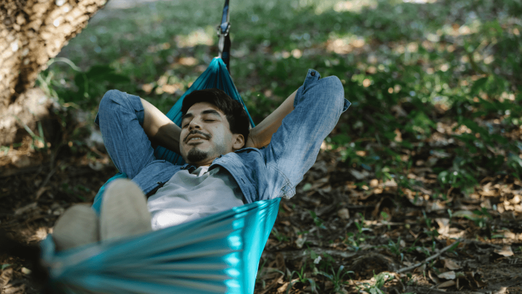 A person relaxing in a hammock