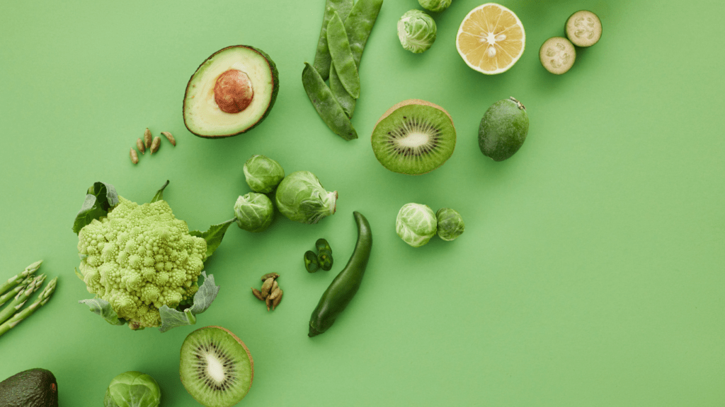 various fruits and vegetables on a green background