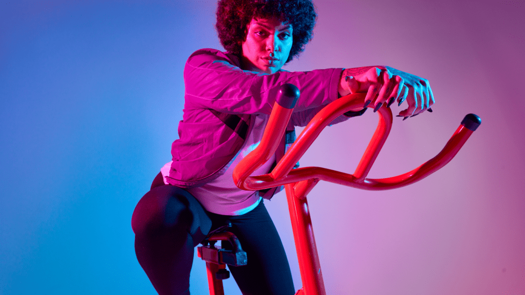 a person is riding an exercise bike in a gym