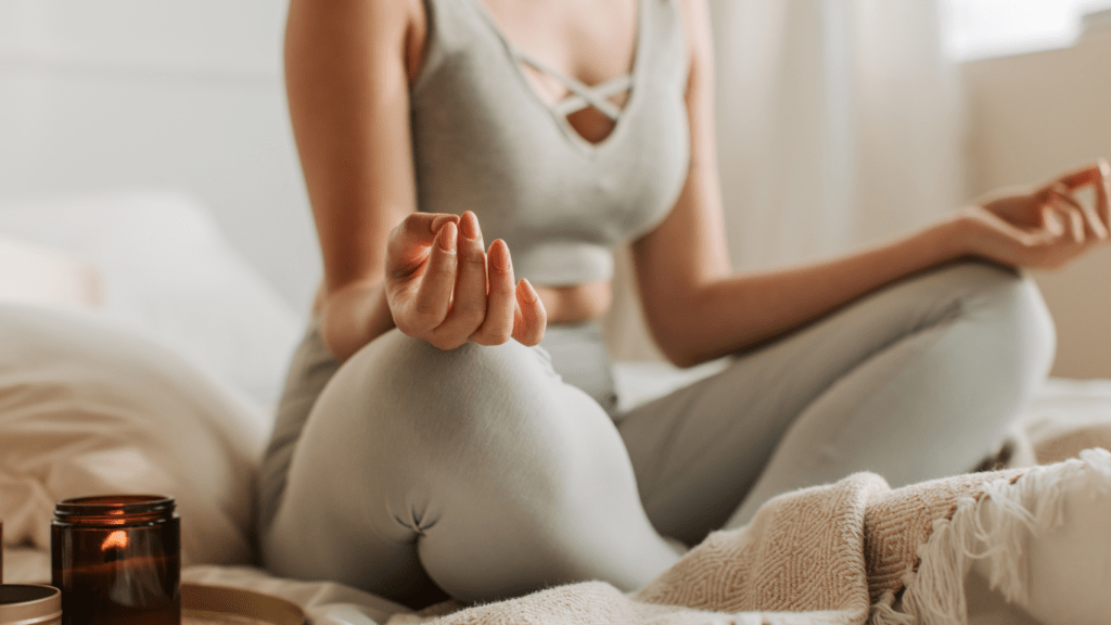 a person is sitting in the middle of a yoga pose