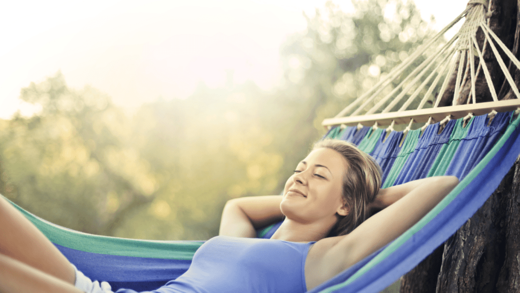 a person is sleeping in a hammock