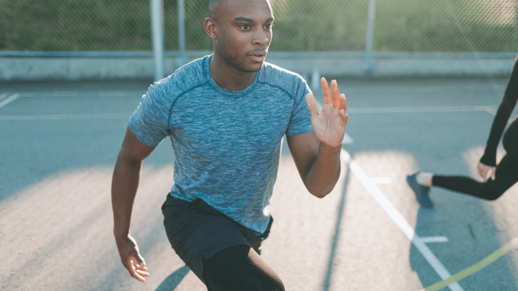 a person is stretching on a running track